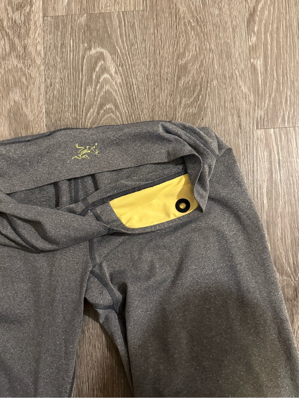 Arcteryx Gray Athletic Leggings with Yellow Pocket Accent